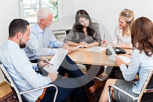 Lawyers having team meeting in law firm