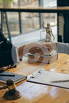 Lawyers shake hands with businessmen to make a deal. legal advisor