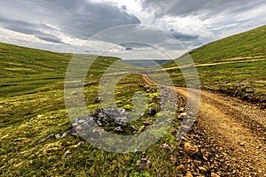 Laxardalsvegur road through the Wild landscape of Vesturland region of Iceland photo