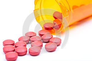 Laxative&stool softener. Sennosides & Docusate sodium coated tablets in orange plastic container. photo
