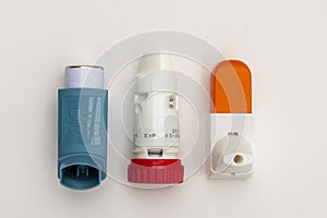 Lay flat of three Asthma Inhalers used to treat the condition