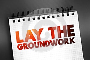Lay The Groundwork text quote on notepad, concept background