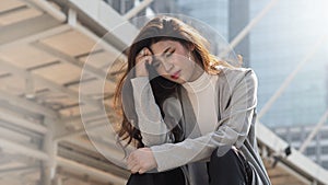 Lay off. Sacked. Fired business woman sitting on stairs of office building outside