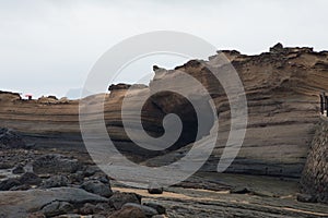 A layer of black rock stone near the sea photo