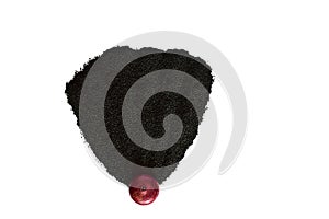 A layer of onion seeds in the form of a sector on a white background.