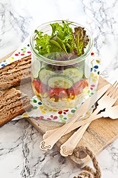 Layer salad in vintage jar