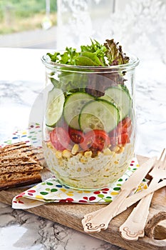 Layer salad in vintage jar