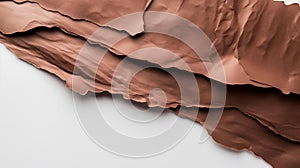 Layered brown crinkled paper with wavy edges on a white background