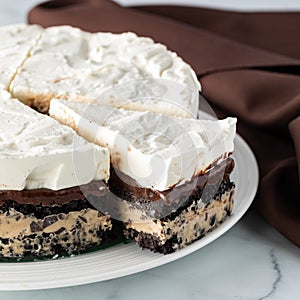 Layered chocolate and coffee ice cream pie, ready for serving.