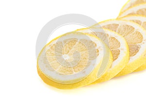 Layered circular slices of yellow lemon