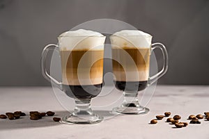 Layered coffee latte drinks. Hot coffee drinks in glass mugs