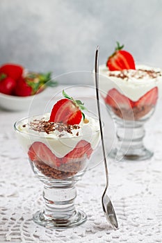 Layered Dessert of chocolate sponge cake, whipped cream or ricotta and fresh strawberries