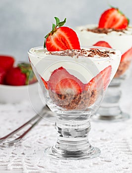 Layered Dessert of chocolate sponge cake, whipped cream or ricotta and fresh strawberries