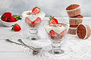 Layered Dessert of chocolate sponge cake, whipped cream or ricotta and fresh strawberries