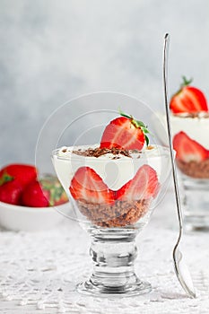Layered Dessert of chocolate sponge cake, whipped cream or ricotta and fresh strawberries