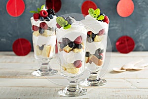 Layered dessert parfait with sweet bread and berries