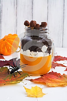 Layered halloween dessert in glass jars