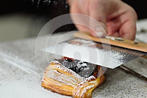 Layered loaf with blackberries and powdered sugar