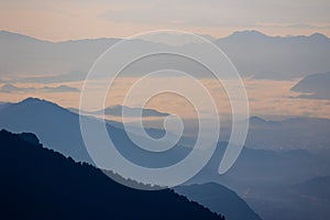 Layered Mountains Above the Clouds