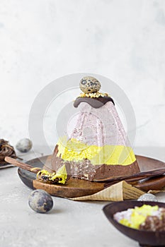 Layered paskha with chocolate, berries and curcuma. Traditional Russian or Ukrainian orthodox Easter quark dessert.