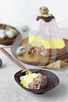 Layered paskha with chocolate, berries and curcuma. Traditional Russian or Ukrainian orthodox Easter quark dessert.