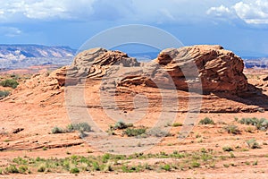 Layered rock in dry and arid desert around Glen Canyon National Recreation Area