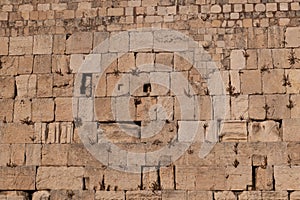 The layered stones of the Western Wall in the Old City of Jerusalem, Israel