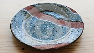 Layered in wavy patterns creating an abstract and artistic look.