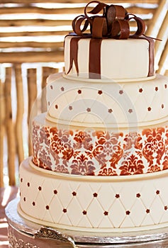 Layered white wedding cake with chocolate detail