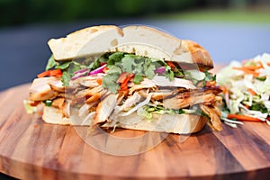 layering slaw atop hickory-smoked chicken sandwich