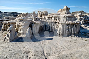 Layers of columns support horizontal segments of sandstone at the Bisti Badlands