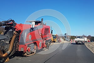 Laying asphalt with the help of heavy special equipment. The construction of the road. Modern technologies laying highway with a