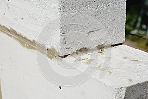 Laying autoclaved aerated concrete blocks for house wall. Close up on laying blocks