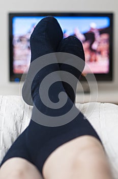 Laying in bed and watching tv