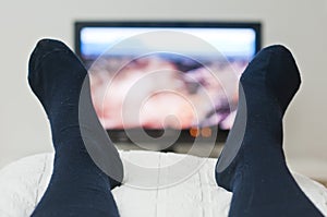 Laying in bed and watching tv