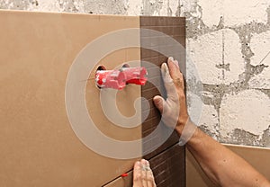 Laying ceramic tile on wall