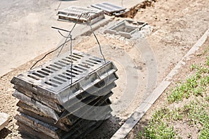 Laying concrete manholes and drain pipes for stormwater system. Connecting a trench drain to a concrete manhole