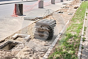 Laying concrete manholes and drain pipes for stormwater system. Connecting a trench drain to a concrete manhole