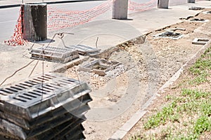 Laying concrete manholes and drain pipes for stormwater system. Connecting a trench drain to a concrete manhole