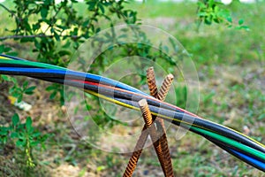 Laying of an electric cable on the street of different colors.