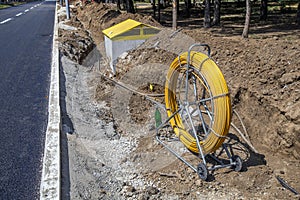 Laying a fiber optic cable and electricity cables