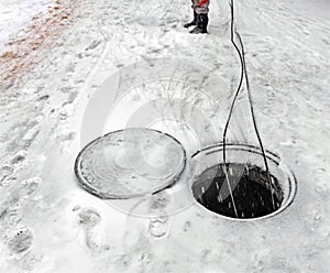 Laying of fiber optic cable through underground communications i