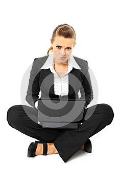 Laying on floor business woman using laptop