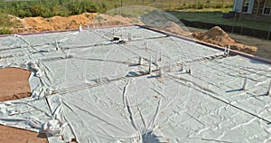 Laying in the ground PVC pipes before pouring concrete