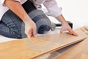 Laying laminate flooring - closeup