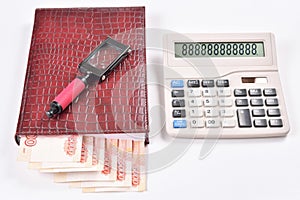 The laying out of money in calendar, calculator and magnifier