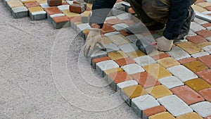 Laying Paving Slabs by mosaic close-up. Road Paving, construction.