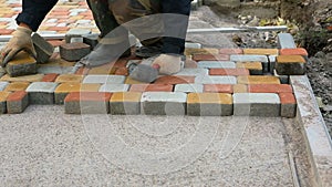 Laying Paving Slabs by mosaic close-up. Road Paving, construction.