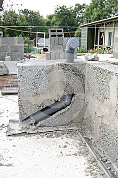 Laying a sewer pipe in the wall during the construction of a house
