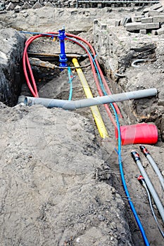 Laying of underground cables and pipes in the residential const